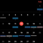 Giao diện chế độ xem tháng mặc định của ứng dụng Lịch Apple trên iOS 18
