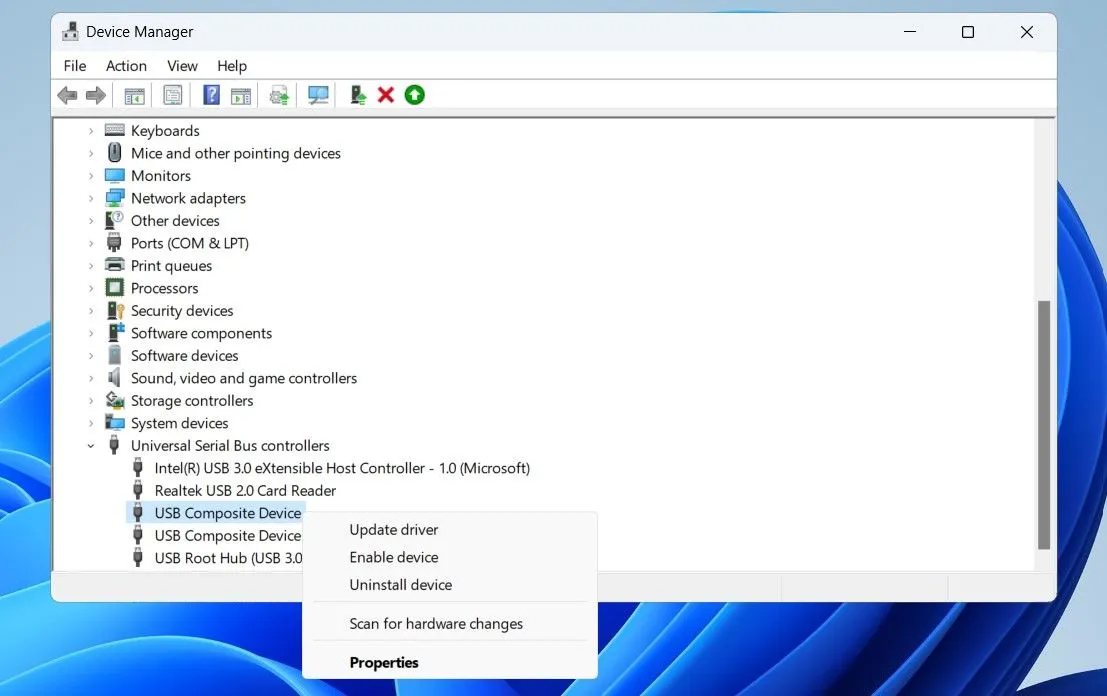 Trình quản lý Thiết bị trên Windows hiển thị tùy chọn 'Enable device' cho một thiết bị trong mục Universal Serial Bus controllers.